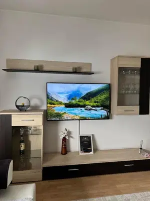 a living room with a flat screen tv on a wall at Apartment Meskovic in Tuzla