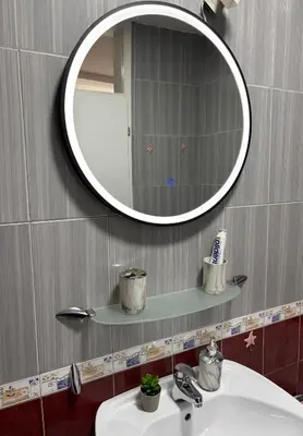 a bathroom with a sink and a mirror on the wall at Apartment Meskovic in Tuzla