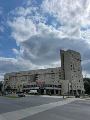 a large building with a turkey sign on it at Apartment Meskovic in Tuzla