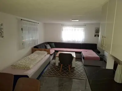 a living room with a couch and a table at Apartman Ventus in Bihać