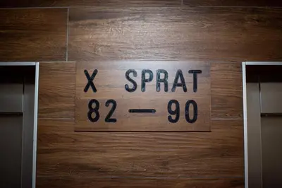 a sign on a door that says x spread at Royal Imperial in Doboj