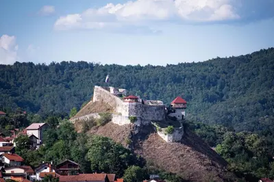 a castle on top of a hill with houses at Royal Imperial in Doboj