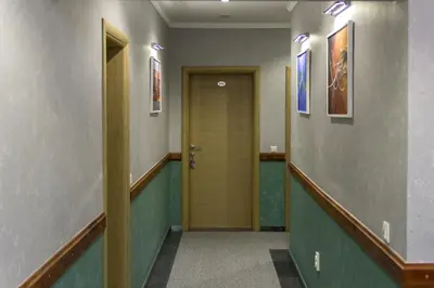a hallway with a door in a building at Motel Calypso Travnik in Travnik