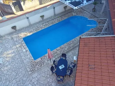 an overhead view of a blue swimming pool at Villa S&M in Ivišovo Greblje