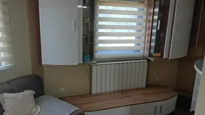a kitchen with a window and a wooden counter at PANONSKA JEZERA Zelena Oaza in Tuzla
