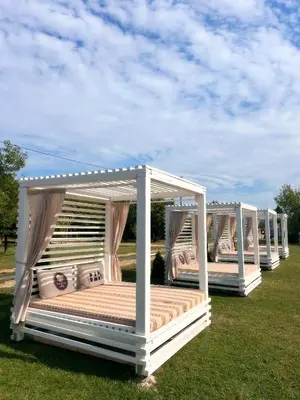two beds in a gazebo in the grass at Sofkin salas in Prijedor