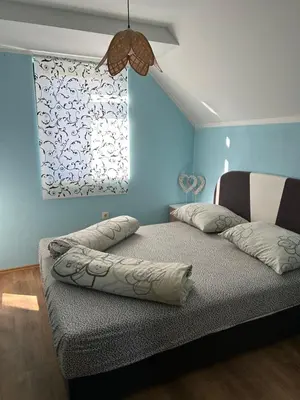 a bedroom with two beds and a window at Sofkin salas in Prijedor