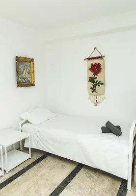 two beds in a room with white walls at APP&ROOMS MG Jablanica in Jablanica