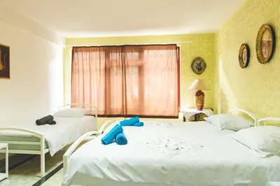 a bedroom with two beds and a blue teddy bear on the bed at APP&ROOMS MG Jablanica in Jablanica