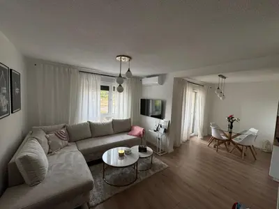 a living room with a couch and a table at Apartman I&I in Kiseljak