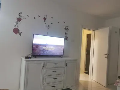 a flat screen tv on top of a dresser at Stan na dan - zvijezda Danica Kozarska Dubica in Bosanska Dubica