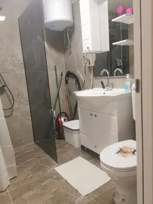 a bathroom with a shower and a toilet and a sink at Stan na dan - zvijezda Danica Kozarska Dubica in Bosanska Dubica