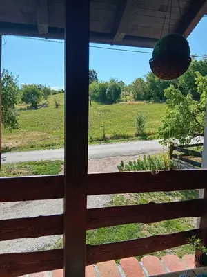 a view of a field from the window of a house at Vikendica Dion in Srebrenik