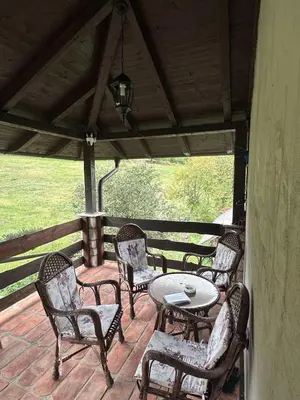 a group of chairs and a table on a patio at Vikendica Dion in Srebrenik