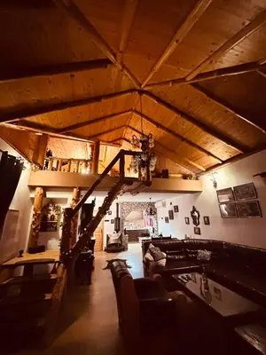 a living room with a staircase in a house at Vikendica Dion in Srebrenik