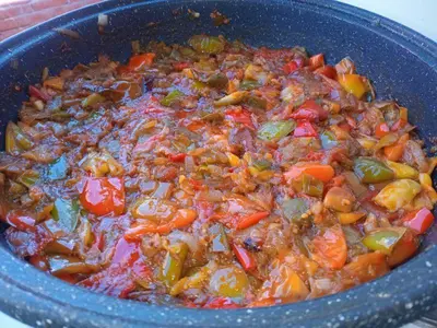 a blue pot of food with vegetables and meat at Vikendica Lazar in Banja Luka