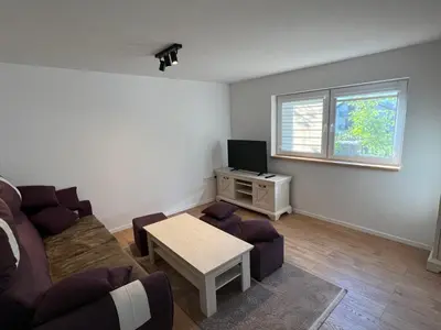 a living room with a couch and a tv at Travnik Nature in Travnik