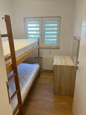 a room with two bunk beds and a desk at Travnik Nature in Travnik