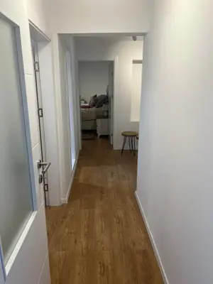 a hallway leading to a room with a bed at Travnik Nature in Travnik