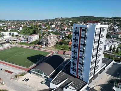 an aerial view of a building with a soccer field at SkyDeck8 in Cazin