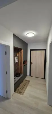 an empty room with a door and a rug on the floor at SkyDeck8 in Cazin