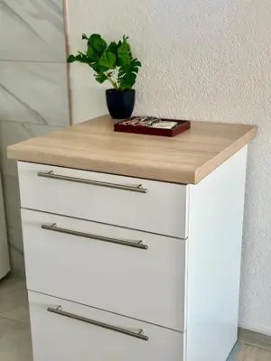 a white chest of drawers with a wooden counter top at Hilltop Family House Panoramic Views in Dobrnja