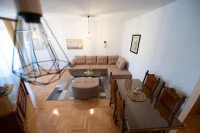 a living room with a couch and a table at Apartman Magija in Banja Luka