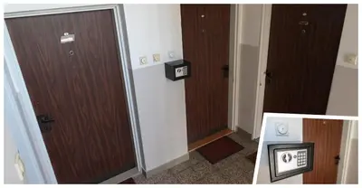 a hallway with two wooden doors in a room at Apartman Magija in Banja Luka