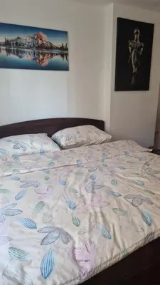 a bed in a bedroom with a bedspread with shells on it at Apartman Katja Travnik in Travnik