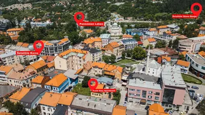 an aerial view of a city with red pointers at Tuzla Stay Apartment in Tuzla
