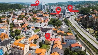 an aerial view of a city with red circles at Tuzla Stay Apartment in Tuzla