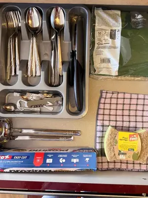 a tray of utensils with spoons and forks at Beauty Room Apartman in Prnjavor