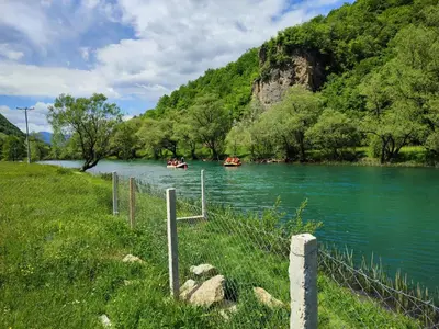 two boats in a river with people in them at Whisper of the Pliva in Šipovo