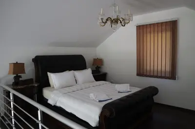 a bedroom with a bed with two towels on it at Villa Duboka Bugojno in Bugojno