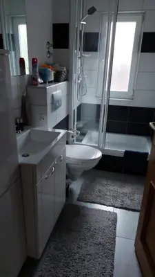 a bathroom with a shower and a sink and a toilet at 1 Room Apartment Kuckovic in Bihać
