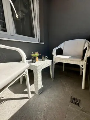 a room with two chairs and a table and a window at Ada by AA Stan na dan in Železnička Stanica Incel