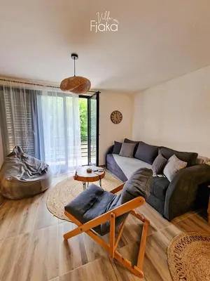 a living room with a couch and a table at Villa Fjaka in Banja Luka