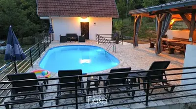 a swimming pool in the middle of a house at Villa Fjaka in Banja Luka