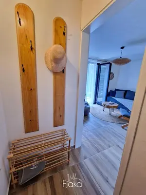 a living room with wooden panels on the wall at Villa Fjaka in Banja Luka