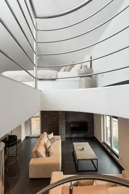 a living room with a couch and a fireplace at NADA Home in Čelebić