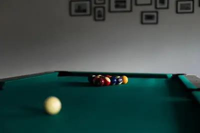 a pool table with cue balls on top of it at NADA Home in Čelebić