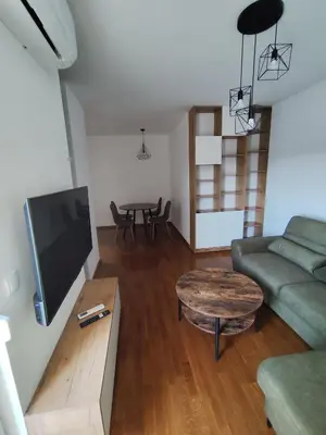 a living room with a couch and a table at AnyBL03 in Železnička Stanica Incel