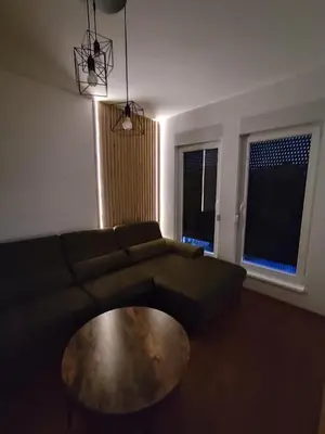 a living room with a couch and a coffee table at AnyBL03 in Železnička Stanica Incel