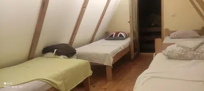 a room with three beds in a room at IvanA vikendica,Krupa na Vrbasu in Banja Luka