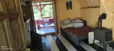 a small room with a bed and a television at IvanA vikendica,Krupa na Vrbasu in Banja Luka