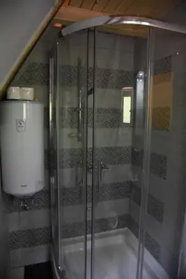 a shower with a glass door in a bathroom at IvanA vikendica,Krupa na Vrbasu in Banja Luka
