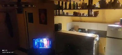 a small television in a room with a kitchen at IvanA vikendica,Krupa na Vrbasu in Banja Luka