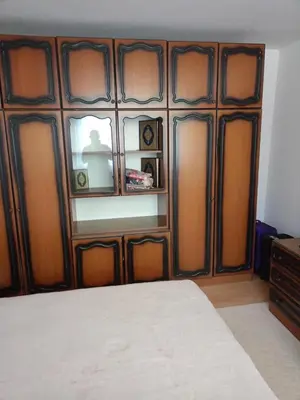 a bedroom with a wooden headboard and a window at Villa in Breza Village