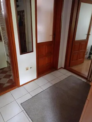 a hallway with two doors and a tile floor at Villa in Breza Village