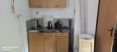 a kitchen with a sink and a counter top at Holiday home SaFari in Bosanska Krupa